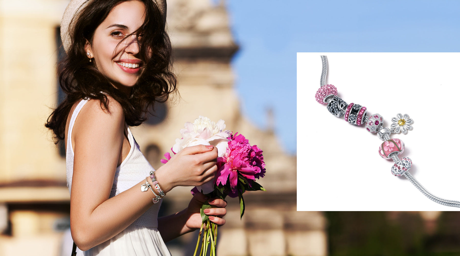 young woman smiling, wearing  charm bracelets and holding flowers